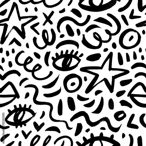 Abstract childish doodle seamless pattern with stars, eyes, squiggles and dots.
