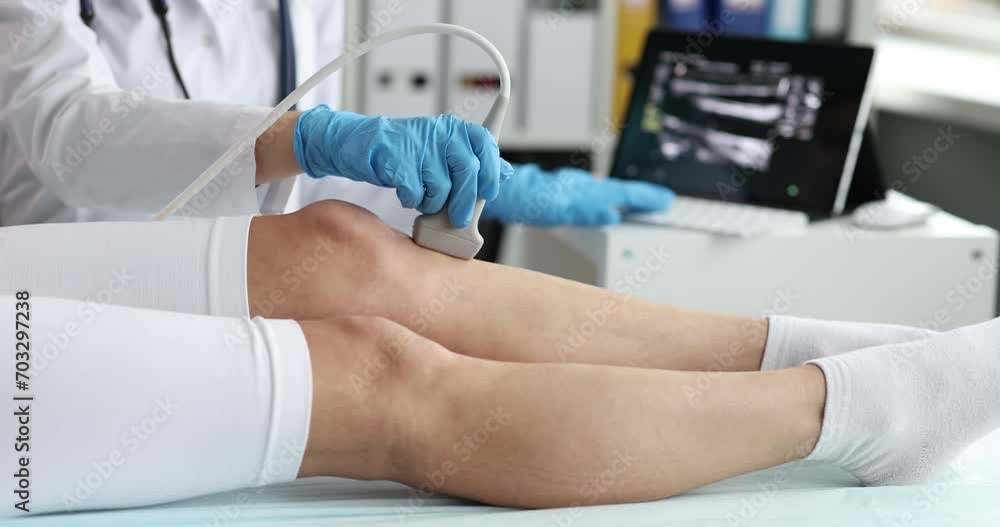 vid-o-stock-doctor-conducts-ultrasound-examination-of-the-knee-joint