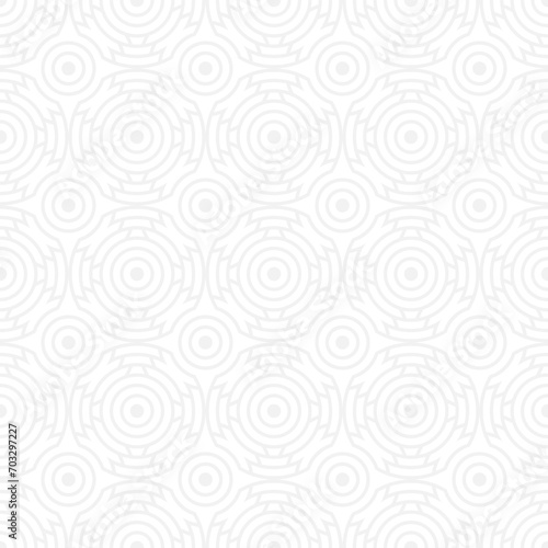 Seamless trendy pattern of circles and arcs, geometric white shapes for textiles and wallpaper. Festive Christmas pattern on a gray background. © Nadzeya Pakhomava