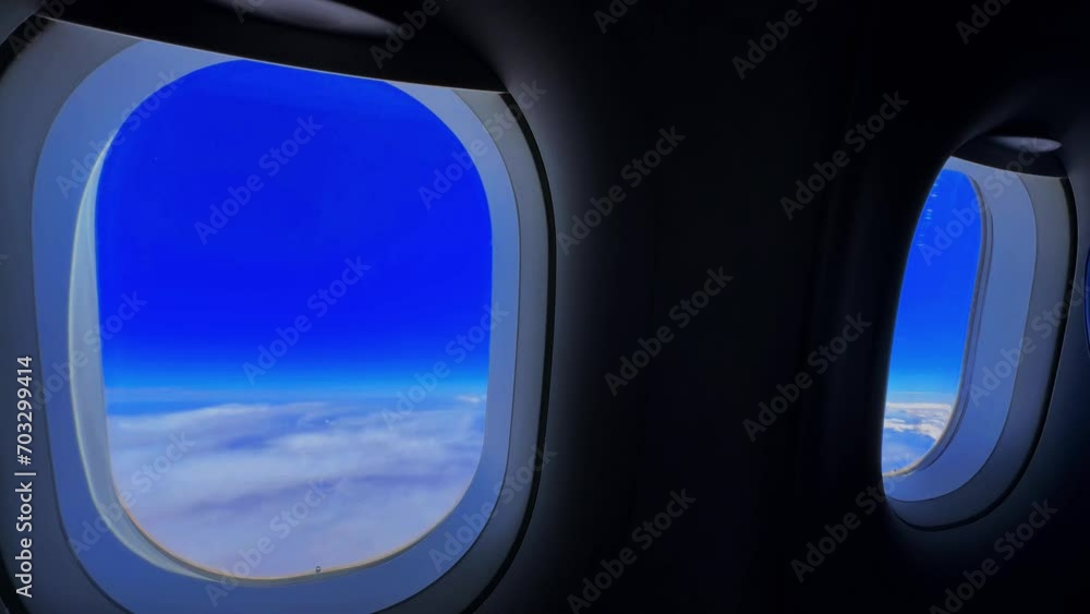 view from an airplane window, clear sky with clouds over the mountains, sky from an airplane window view from an airplane window, clear sky with clouds over the mountains, sky from an airplane window