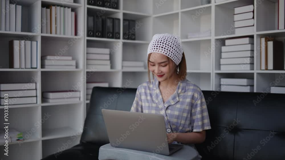 short hair woman is typing for chatting with friends and shopping online on laptop with happy face. short hair woman is typing for chatting with friends and shopping online on laptop with happy face.