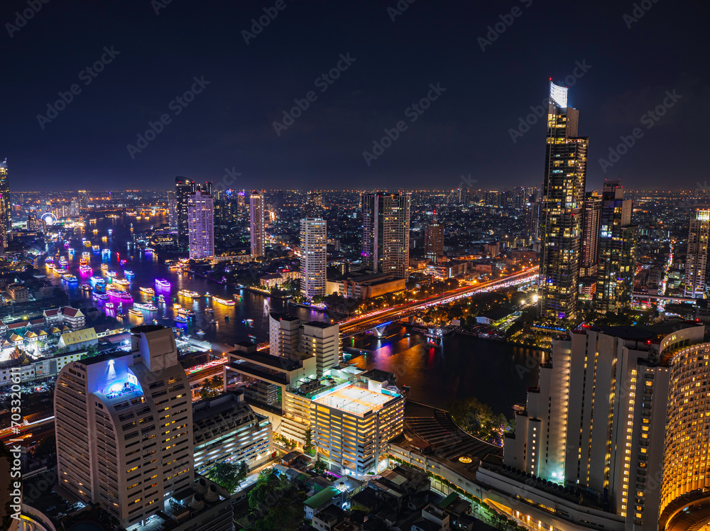 Naklejka premium Beautiful cityscape Bangkok river boat business district and residential. In the twilight,