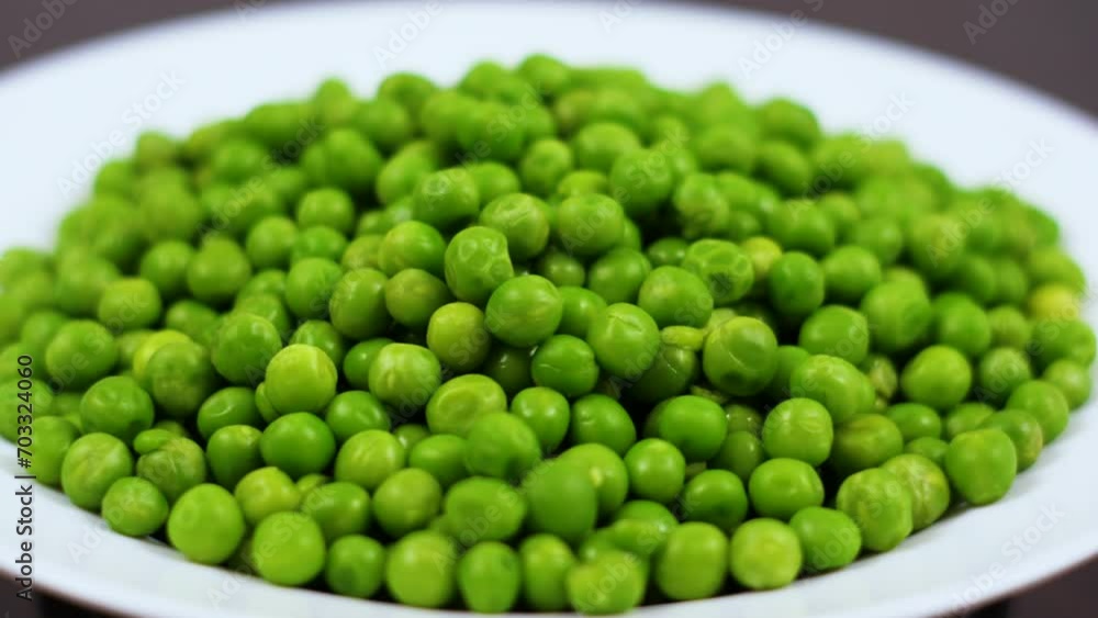Close Up Green Peas Background Rotating. Macro Shot Fresh Organic Green Peas. Vegetable Harvest Healthy Eating. Beautiful Texture Close-up of Fresh Green Peas. Healthy Vegetarian food. Close Up Green Peas Background Rotating. Macro Shot Fresh Organic Green Peas. Vegetable Harvest Healthy Eating. Beautiful Texture Close-up of Fresh Green Peas. Healthy Vegetarian food.