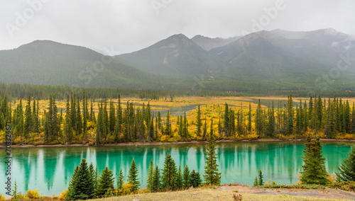 Backswamp Viewpoint. Bow River in fall foliage season, mountains in the background. Banff National Park, Canadian Rockies, Alberta, Canada.