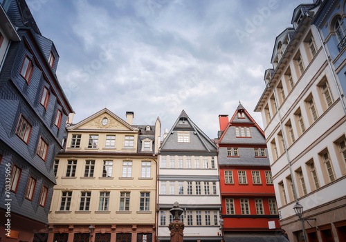 spring trip to Europe. beautiful old German cities, Travel and German sightseeing locations. scenic view to facade of old historic houses somewhere in Frankfurt city #703325056
