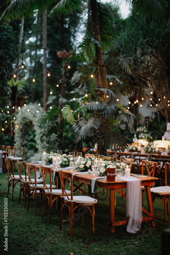 Outdoor Decoration for wedding event or avenue. Family dinner. Gathering. Engagement. Private party. Pool side. Drop lights. Floating candles. Table Setting. Center piece flowers. 