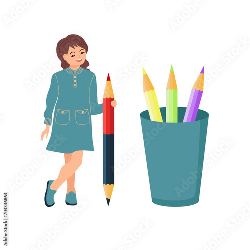 The girl holds a big pencil. Multi-colored pencils in a glass