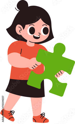 Little girl holding a piece of a puzzle © kappacha