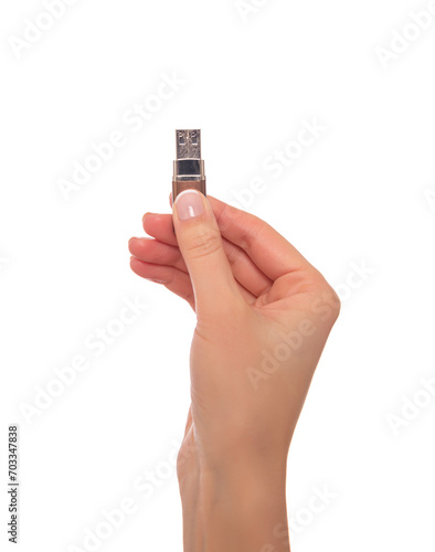 Vászonkép A woman's hand holds a flash drive