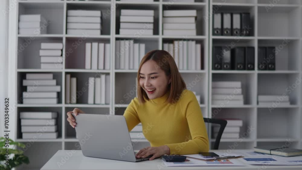 Yellow sweater woman is feeling win and happy to finish working on laptop or get rewards for success in dealing. Yellow sweater woman is feeling win and happy to finish working on laptop or get rewards for success in dealing.