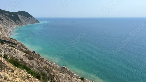 Panoramic view of the sea surface from the coast. Black Sea, Anapa, Krasnodar Territory, Russia. Sunset view of Bald Mountain near the village of Supseh. The beach has 800 steps. 4K Video photo