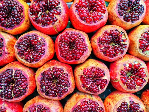 background of pomegranates ready for juice