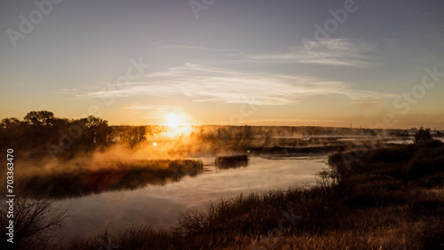 Colorful fog over the lake in autumn at dawn © Павел Чигирь