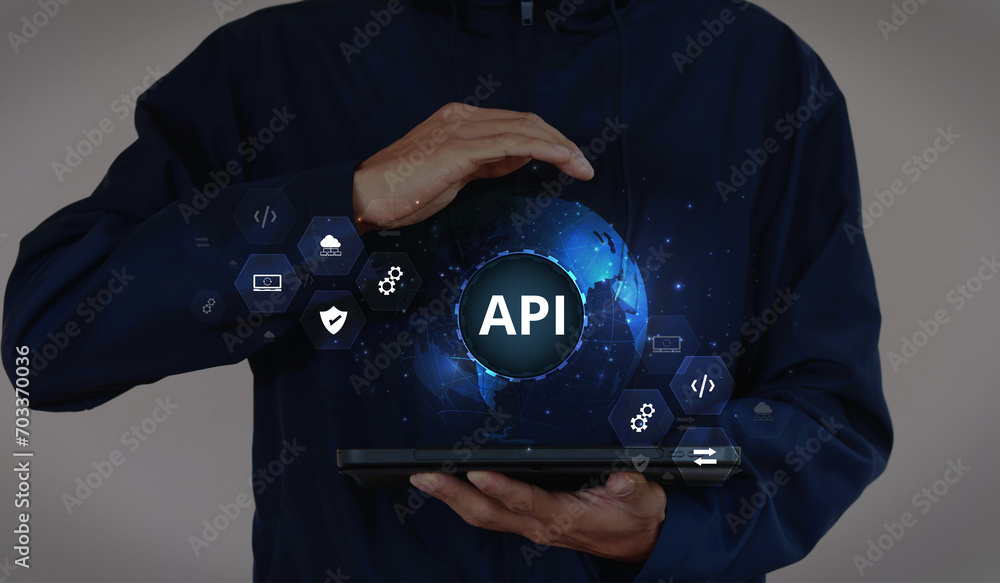 Application Programming Interface (API). Software development tools, information technology, modern technology, internet, and networking concepts on a dark blue background. Application Programming Interface (API). Software development tools, information technology, modern technology, internet, and networking concepts on a dark blue background.