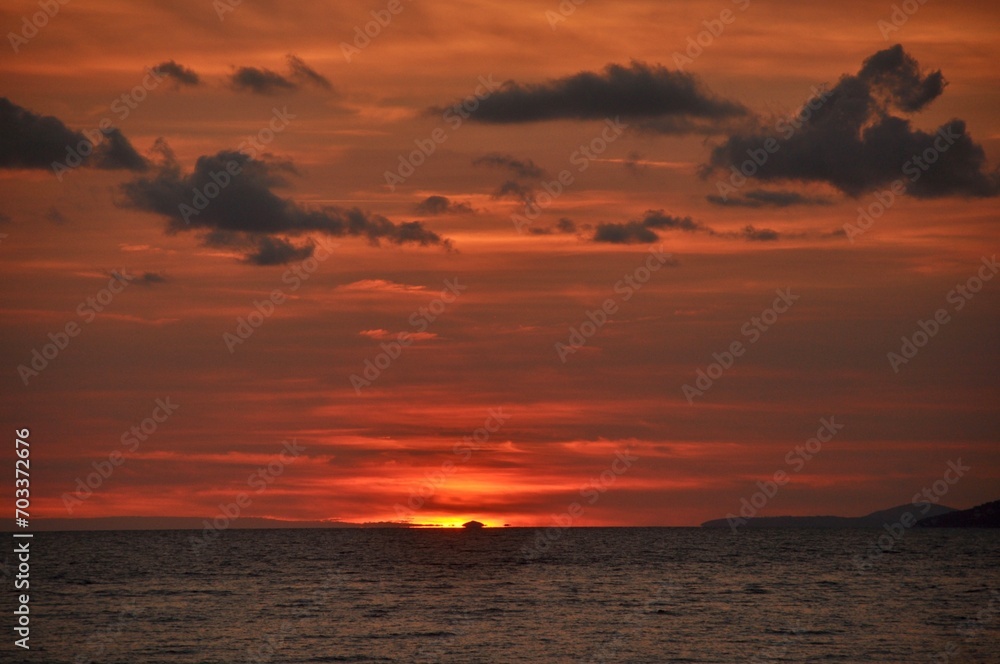 Beautiful red sky with sea in the foreground. Sunset over the sea in Croatia. 