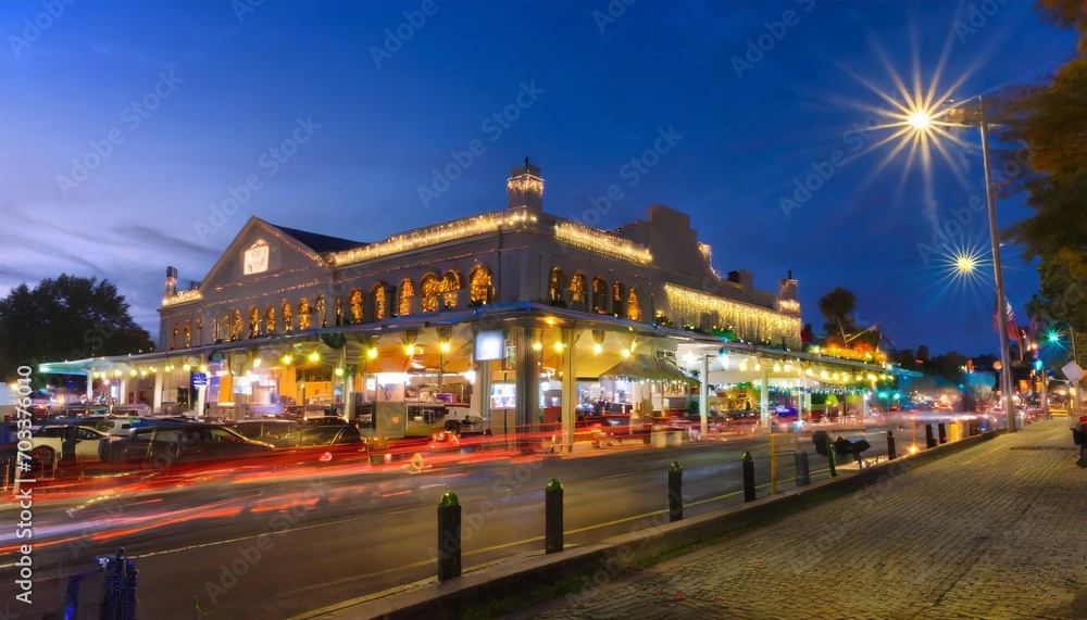 Fototapeta premium public market center at twilight it is an old continually operated public farmers markets in the united states long exposure technic for car light trails