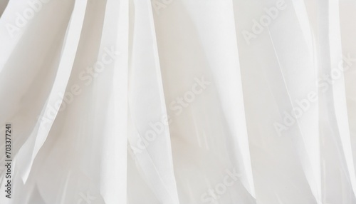 strips of white paper with folds close up