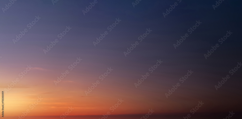 Sunset Sky,Clouds over Beach in the evening with Blue,Red, Orange,Yellow and Purple Sunlight in Summer,Beautiful panoramic nature sunrise, Romantic sky with Dusk Twilight