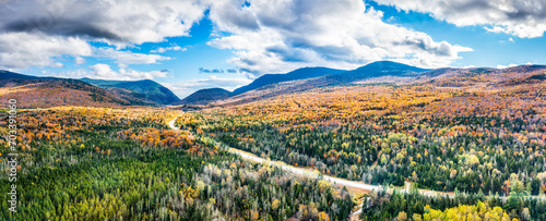 Aerial panorama US route 302 leading to Crawford Notch State park between Mount Webster and Willard. Mt Jackson (left), Willey, Field and Tom (right) are visible in the back. photo