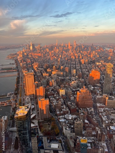 Aerial panoramic view over New-York skyline and Hudson river from One World Observatory deck at One World Trade Center, Winter Sunset