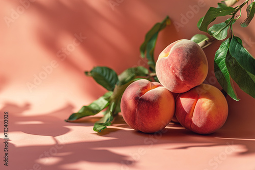 Peach fuzz, color of the year 2024, Trio of Ripe Peaches with Pink and Yellow Hues in a Luminous Summer Fruit Still Life © Patrick