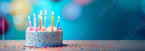 colorful birthday cake with candles, party blurred background, , hcolorful birthday cake with candles, party blurred background, , horizontal banner, copy space forizontal banner, copy space for text. photo