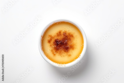 Top view of creme brulee traditional French vanilla cream dessert isolated on the white background photo