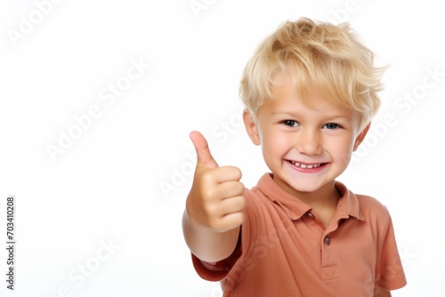 Portrait of happy child boy showing thumbs up gesture  isolated over white background
