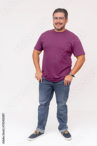A stocky middle aged man wearing glasses.. Full body photo, wearing purple waffle shirt and jeans, isolated on a white background.