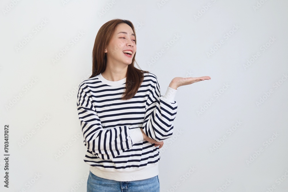portrait of a smiling woman pointing at something over isolated background. portrait of a smiling woman pointing at something over isolated background.