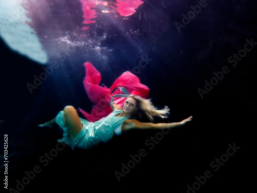 Lexia Smith underwater swimming with long dress