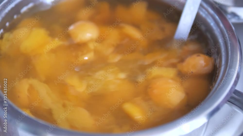 a pot of homemade natural apricot compote, a pot of homemade natural apricot compote,