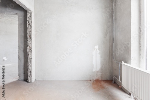 interior of the apartment without decoration in gray colors. rough finish