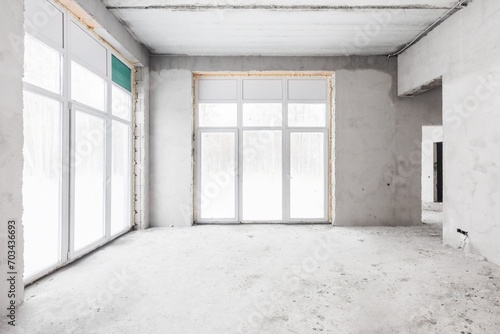 interior of the apartment without decoration in gray colors. rough finish