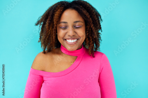 Dreamy young beautiful African American woman with bright eyelines wearing pink bodysuit photo