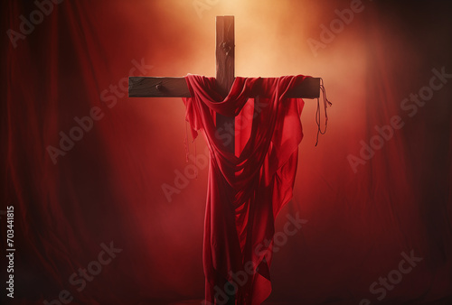 Wooden cross with a red cloth on it photo