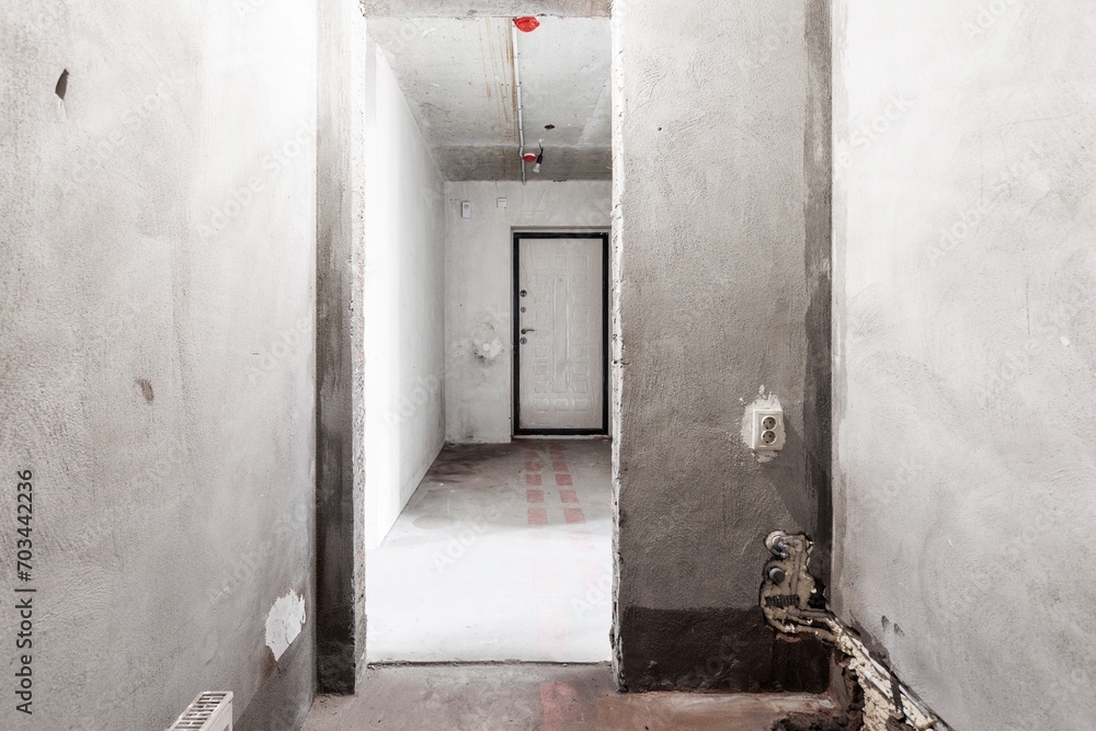 interior of the apartment without decoration in gray colors. rough finish interior of the apartment without decoration in gray colors. rough finish