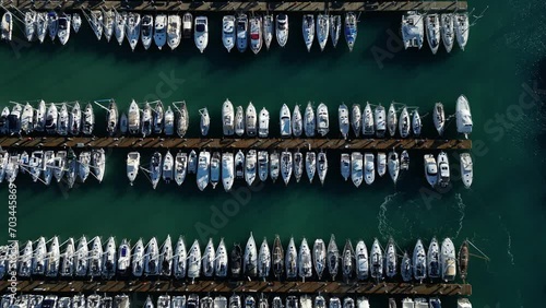 Aerial view of a seaport with moored sailboats