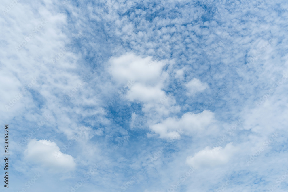 Panoramic view of clear blue sky and clouds, Blue sky background with tiny clouds. White fluffy clouds in the blue sky. Captivating stock photo featuring the mesmerizing beauty of the sky and clouds. Panoramic view of clear blue sky and clouds, Blue sky background with tiny clouds. White fluffy clouds in the blue sky. Captivating stock photo featuring the mesmerizing beauty of the sky and clouds.