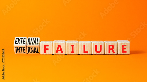 External or internal failure symbol. Concept words External failure or Internal failure on blocks. Beautiful orange table orange background. Business external internal failure concept. Copy space