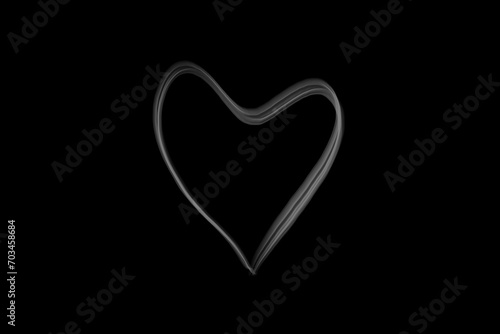 heart shape in moke spreading isolated on dark background