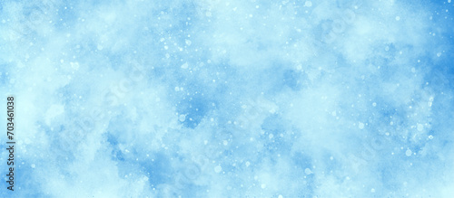 Blue watercolor painting on winter seasonal morning texture, sunshine or sparkling lights and glittering glow winter morning of snow falling background, abstract bokeh glitter background on blue.