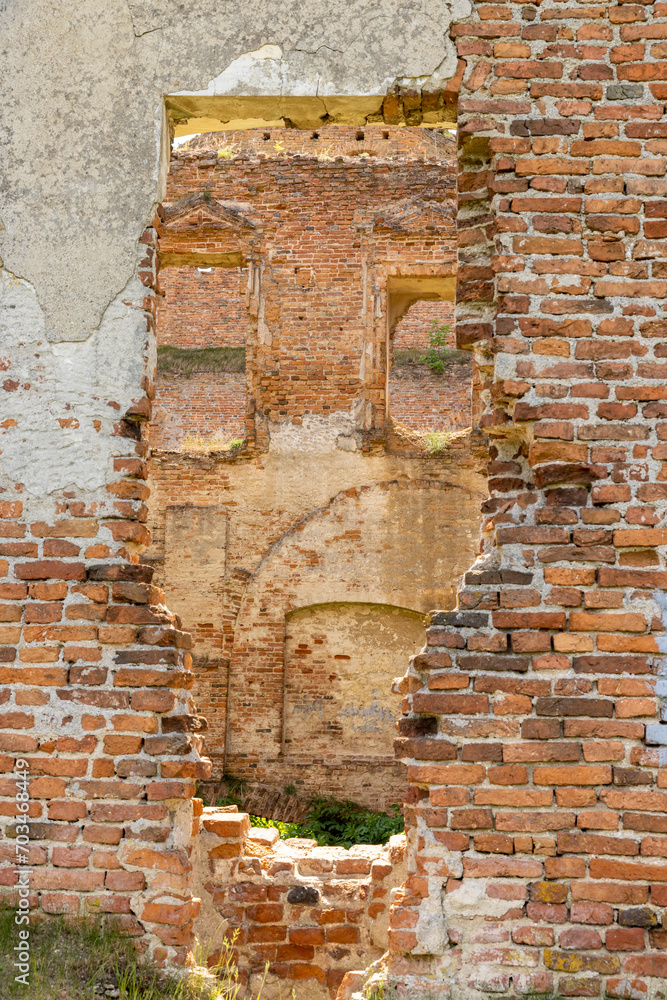 damaged red bricks from the wall of an ancient building