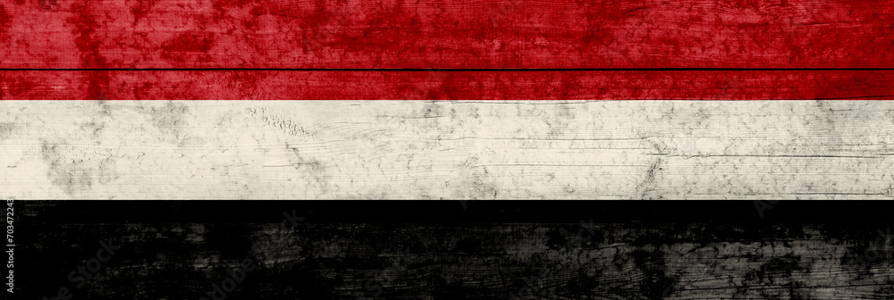 Yemen flag on a wooden surface. Yemen grunge flag. Yemen flag on a wooden surface. Yemen grunge flag.