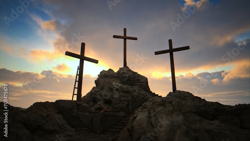 A sunny, beautiful sunrise/sunset at Golgotha on Easter morning featuring three crosses.