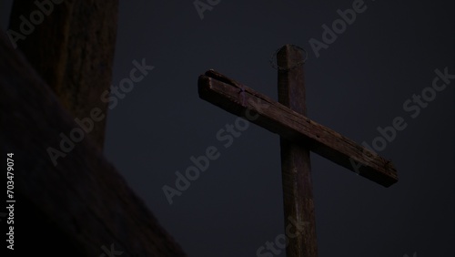 Fotografie A stormy, dark Golgotha on Good Friday featuring three crosses.
