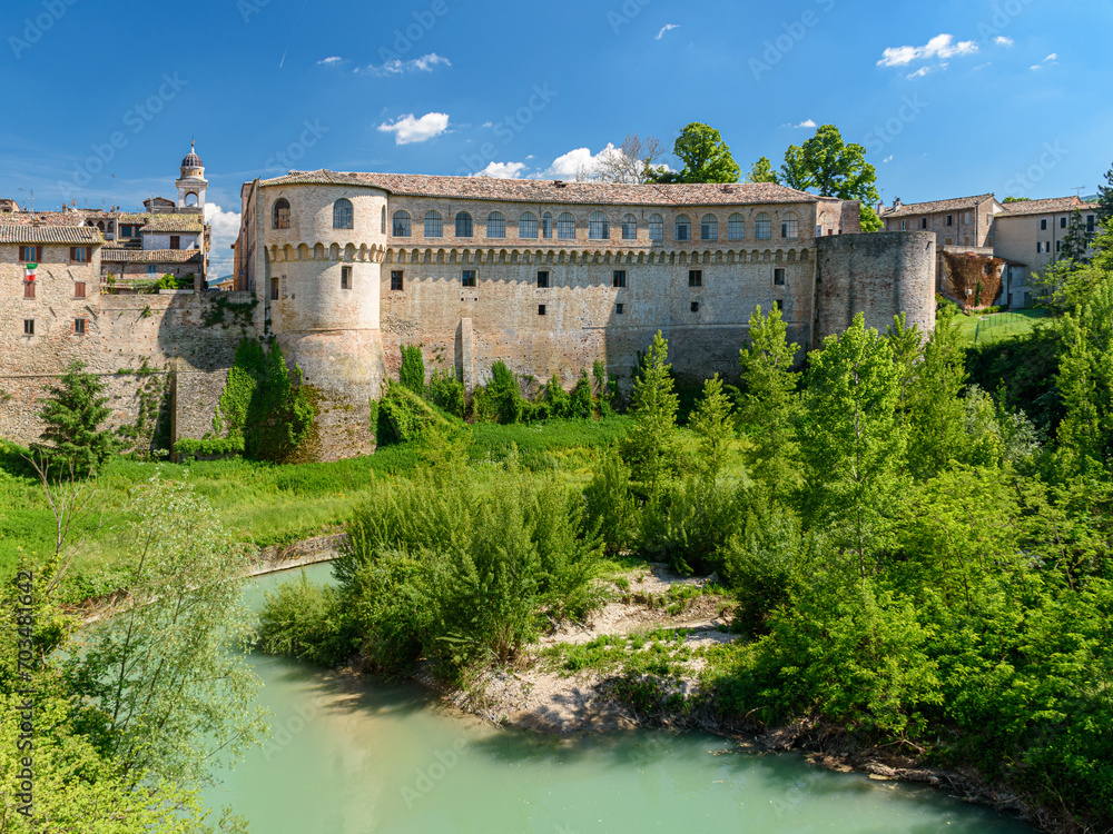 View of Palazzo Ducale, the main building of Urbania, small town in Marche region in central Italy, over the river Metauro