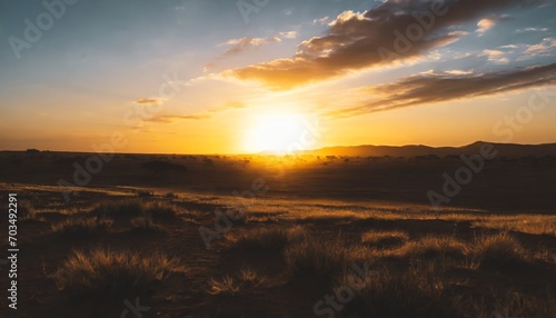 cinematic african landscape sahara grasslands sunrise over the desert plains safari views © Florence