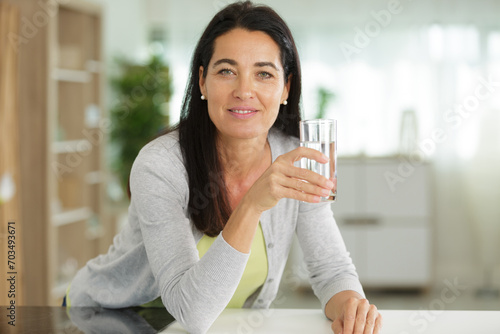 woman drinking water at hopme photo