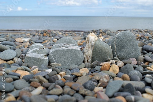 Four rocks on a rocky beach. High quality photo